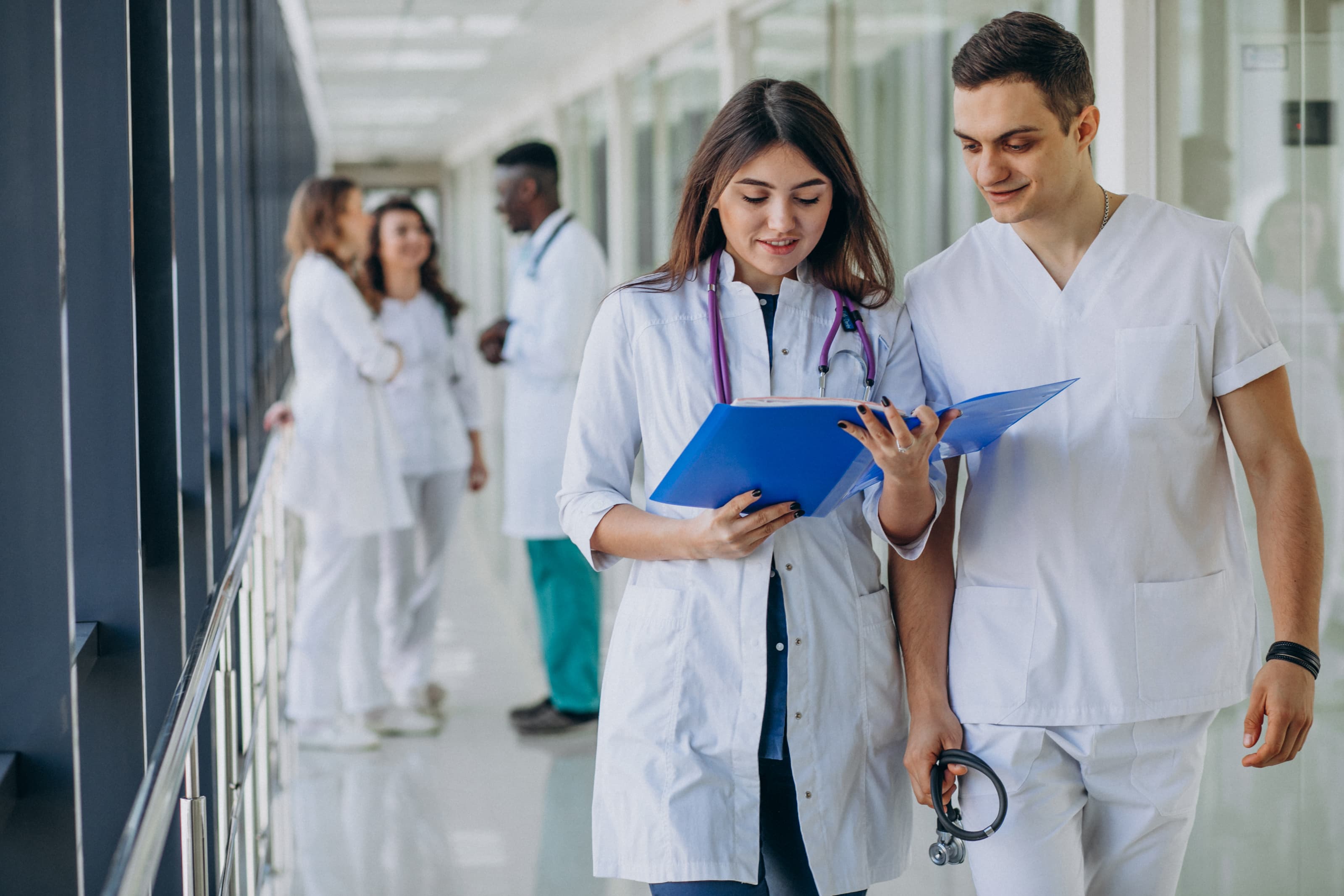 Medical professionals collaborating in a hospital corridor