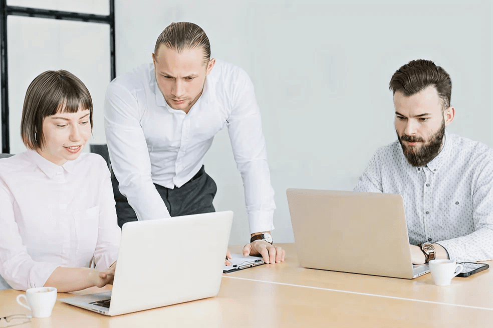 Business professionals collaborating around a table in a modern office